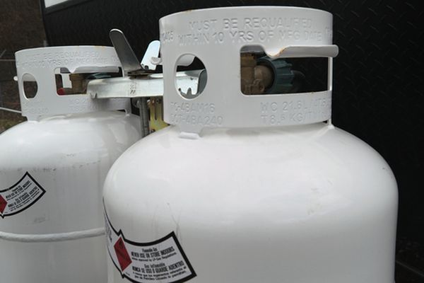 Two,20,Pound,Propane,Tanks,Secured,To,The,Front,Of